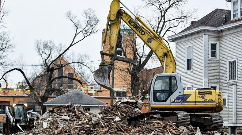 Middletown is seeking bids to demolish nine more houses in its efforts to clear blight in neighborhood. City officials said there may be some additional properties demolished later this year. This is a house at 209 Yankee Road that was demolished in January. FILE PHOTO A vacant home at 209 Yankee Road is demolished by Vickers Demolition Thursday, Jan. 10, 2019 in Middletown. NICK GRAHAM/STAFF