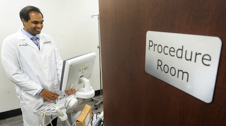 Dr. Gaurav Pahouja at his office in Beavercreek. MARSHALL GORBY\STAFF