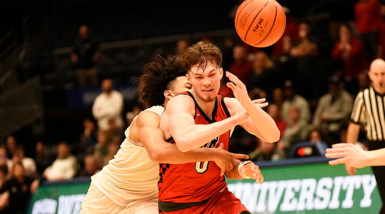 Tippecanoe's CJ Bailey is fouled on the deciding play of his team's comeback victory over LaSalle in their Division III district final game on Saturday, March 7, 2026 at the University of Dayton Arena. Bailey sank one of his two free throws with four seconds remaining to give the Red Devils a 59-58 victory. GEOFF NEVILLE / CONTRIBUTED PHOTO