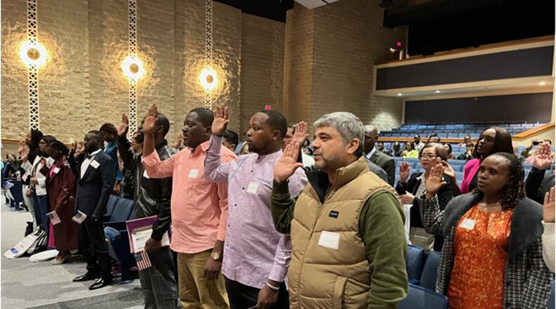 Twenty-nine applicants took their Oath of Allegiance to the United States as they became naturalized U.S. citizens during a ceremony at Springboro High School Thursday, March 21, 2024. ED RICHTER/STAFF