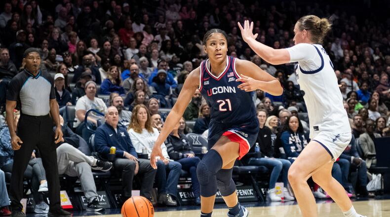 UConn forward Sarah Strong (21) drives toward the basket during the second half of an NCAA college basketball game against Xavier, Sunday, Nov. 30, 2025, in Cincinnati. (AP Photo/Tanner Pearson)
