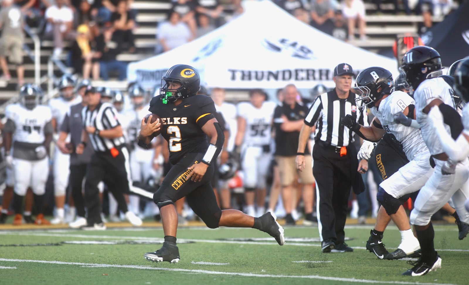 Centerville's Parker Johnson runs for a touchdown against Lakota East on Friday, Aug. 22, 2025, at Centerville Stadium. David Jablonski/Staff