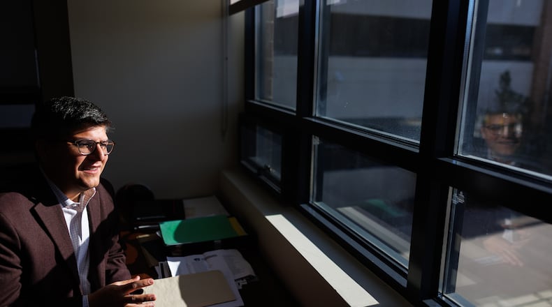 Juan Espinoza, vice provost for enrollment management at Virginia Tech, poses for a photo in his office, Nov. 12, 2025, in Blacksburg, Va. (AP Photo/Shaban Athuman)