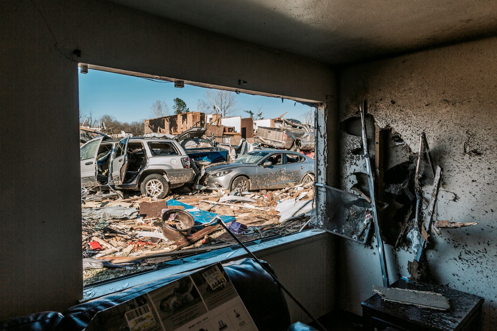 Looking out from the destroyed Dawson Village Apartments in Dawson Springs, Ky., on Monday, Dec. 13, 2021, where a tornado flattened much of the town on Friday night. Determining how many people died in the tornadoes that ravaged the central U.S. on Friday has been a challenging task so far, with estimates fluctuating as search teams continue to spread out amid vast fields of rubble in an effort to rescue the living and account for the dead. (William Widmer/The New York Times)