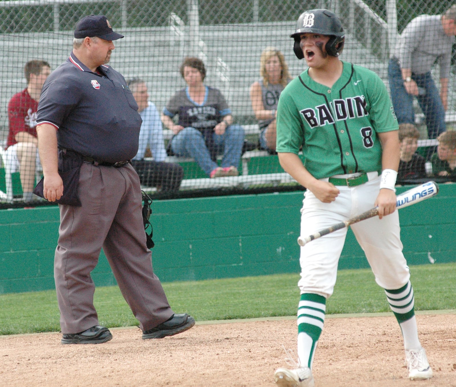 Badin's Kaden Kimbrell reacts after scoring a run May 1 during a 12-2 Greater Catholic League Coed Division baseball victory over visiting Fenwick at Alumni Field in Joyce Park. RICK CASSANO/STAFF