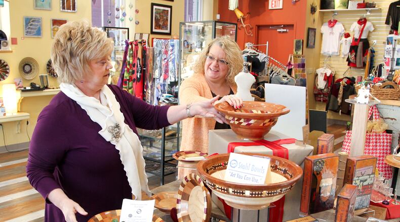 Art Off Symmes owner Sherry Armstead (left) is closing the downtown Hamilton location of the retail store that offers art and collectibles after six years in business. Armstead’s Art On Symmes store in Fairfield will remain open, and she said she hopes to open a “rebranded” store in Hamilton in the future. STAFF FILE PHOTO
