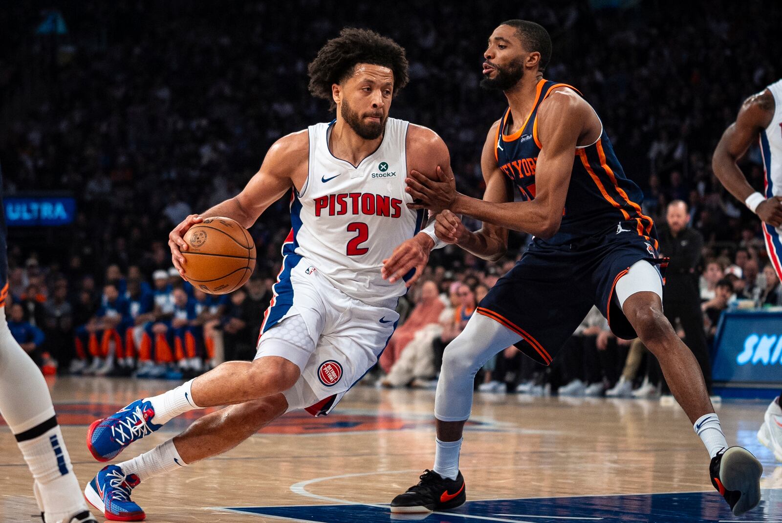 Detroit Pistons guard Cade Cunningham (2) drives toward the basket against New York Knicks' Mikal Bridges during the first half of Game 2 of an NBA basketball first-round playoff series, Monday, April 21, 2025, in New York. (AP Photo/Angelina Katsanis)