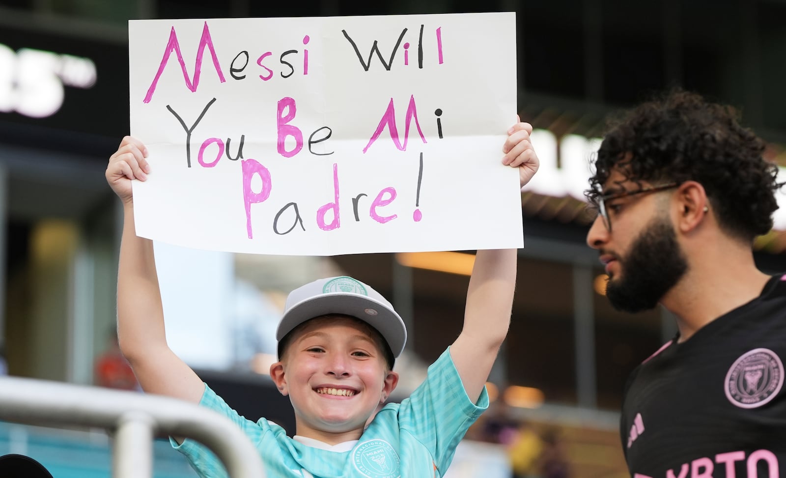 A young fan holds up a placard ahead of the Club World Cup group A soccer match between Al Ahly and Inter Miami in Miami, Fla., Saturday, June 14, 2025. (AP Photo/Lynne Sladky)