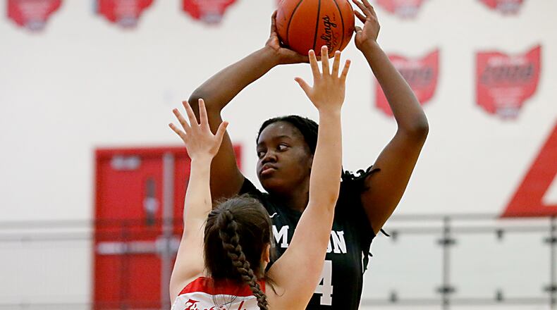 Mason High School center Kyla Oldacre is covered by Lakota West forward Emily Doerman during a Greater Miami Conference basketball game in West Chester Jan. 23, 2021. Contributed photo by E.L. Hubbard