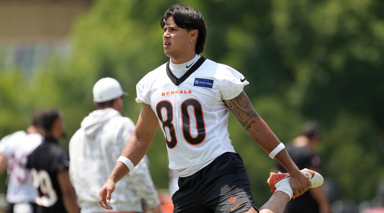 Cincinnati Bengals wide receiver Andrei Iosivas (80) stretches before NFL football practice Tuesday, June 3, 2025, in Cincinnati. (AP Photo/Kareem Elgazzar)