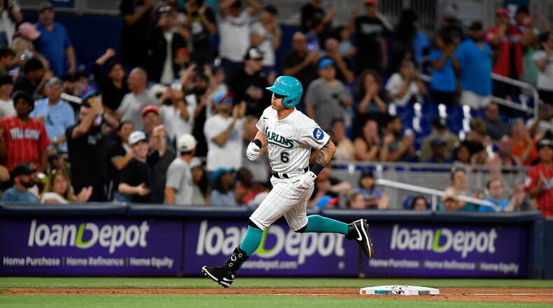 Miami Marlins' Peyton Burdick rounds third base after hitting a home run against the Cincinnati Reds during the sixth inning of a baseball game Friday, May 12, 2023, in Miami. (AP Photo/Michael Laughlin)