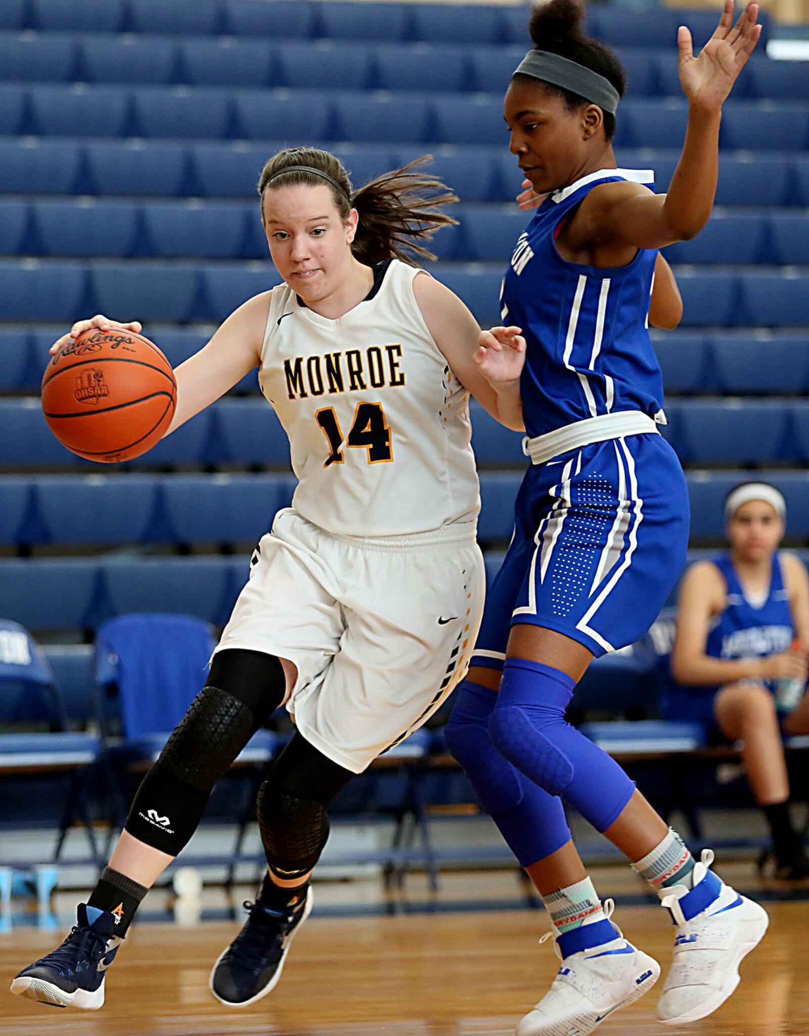 Monroe’s Sophie Sloneker is covered by Hamilton’s Cici Riggins during Saturday’s inaugural All-Butler County All-Star girls basketball game at the Hamilton Athletic Center. CONTRIBUTED PHOTO BY E.L. HUBBARD