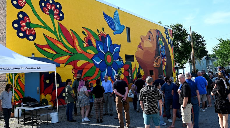 Hamilton Living Waters Church on South 8th Street in the Jefferson neighborhood will be host to the inaugural Posada, a Latino tradition that celebrates Mary and Joseph's search for shelter ahead of their child's birth. Pictured is a gathering at the church in July for the StreetSpark mural titled “Viva El Sueno,” or “Live the Dream," celebrating Hispanic heritage and the potential of the Jefferson neighborhood. MICHAEL D. PITMAN/FILE