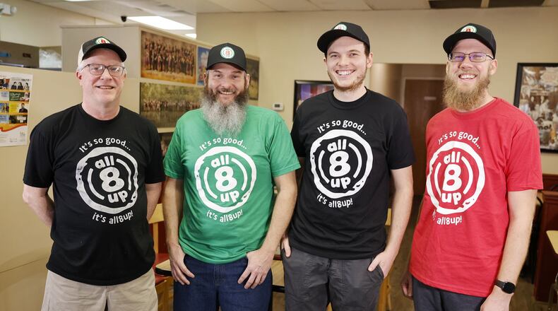 Left to right: Tony Brown, from All8Up, stands with Brad Baker, Bradley Baker and Chris Watkins, from Pinball Garage, Wednesday, Jan. 11, 2023. Brad Baker announced he is purchasing All8Up and expanding to allow them to produce All8Up items and Pinball Garage Brisketology BBQ items they are currently preparing out of their food truck. NICK GRAHAM/STAFF