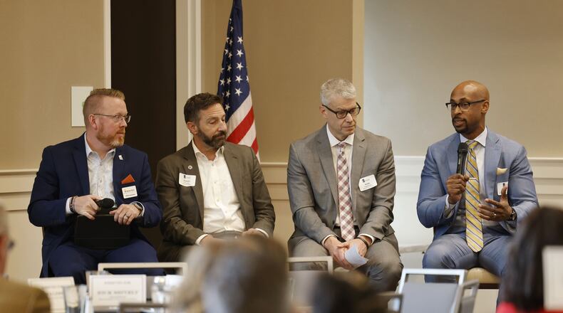 Left to right; William Sprankles, Butler Tech assistant superintendent of innovative teaching and learning, Robbins Hoopes, Cincinnati State Provost, Robb Vogelmann, Lakota interim superintendent, and Ande Durojaiye, vice president of Miami Regionals, talk olabout the state of schools during a West Chester Liberty Chamber Alliance luncheon Tuesday, Feb. 14, 2023 at Centre Park of West Chester in West Chester Township. NICK GRAHAM/STAFF