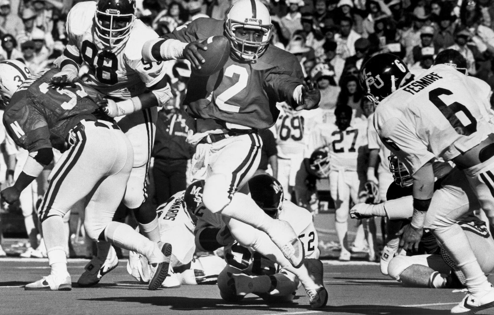FILE - Nebraska running back Jarvis Redwine does a bit of high stepping as he picks up 12 yards and a first down in the fourth quarter of the Sun Bowl college football game against Mississippis State, Saturday, Dec. 29, 1980, in El Paso, Texas. (AP Photo/JG, File)