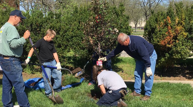 Volunteers during previous Keep Middletown Beautiful events on Earth Day. STAFF FILE PHOTO