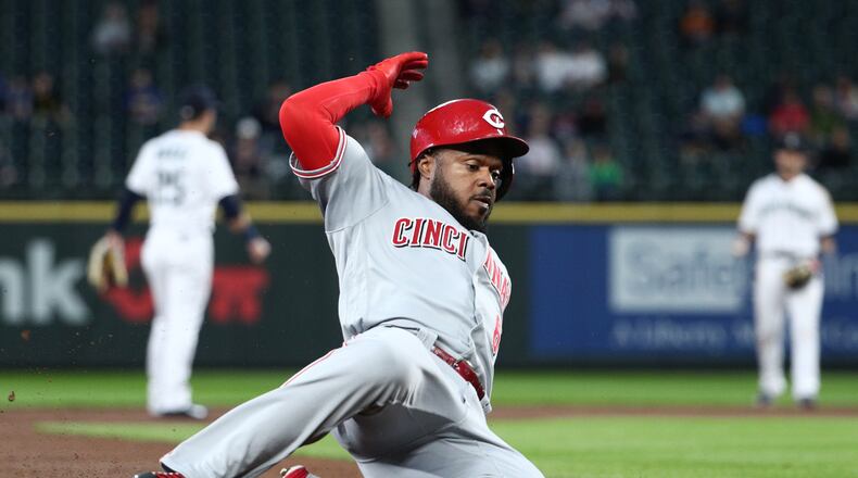 SEATTLE, WASHINGTON - SEPTEMBER 10: Phillip Ervin #6 of the Cincinnati Reds slides into third base after hitting a triple in the second inning against the Seattle Mariners during their game at T-Mobile Park on September 10, 2019 in Seattle, Washington. (Photo by Abbie Parr/Getty Images)