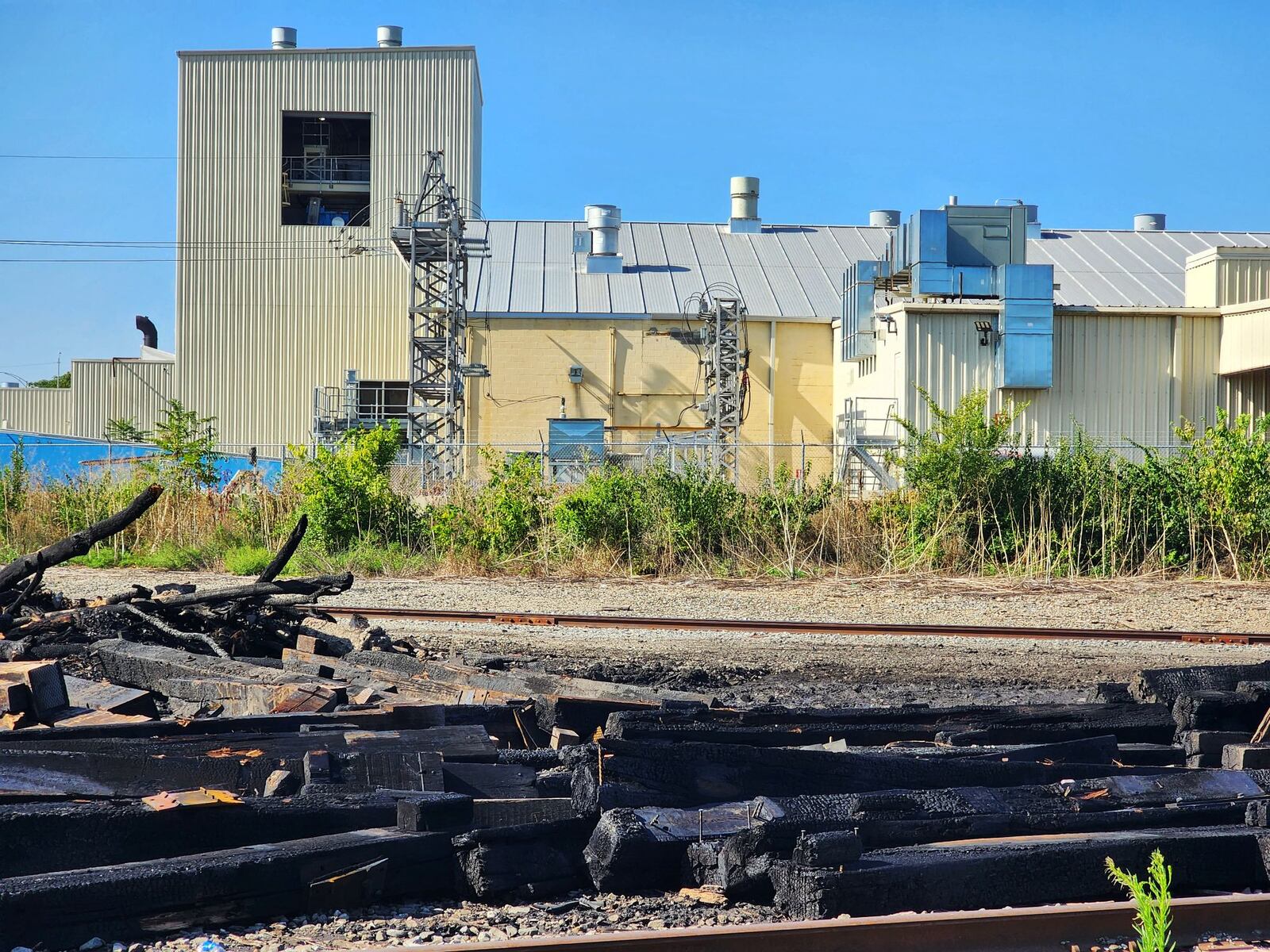 A pile of railroad ties caught fire Sunday afternoon near Graphic Packaging International in Middletown. The cause of the fire remains under investigation, according to fire officials. NICK GRAHAM/STAFF