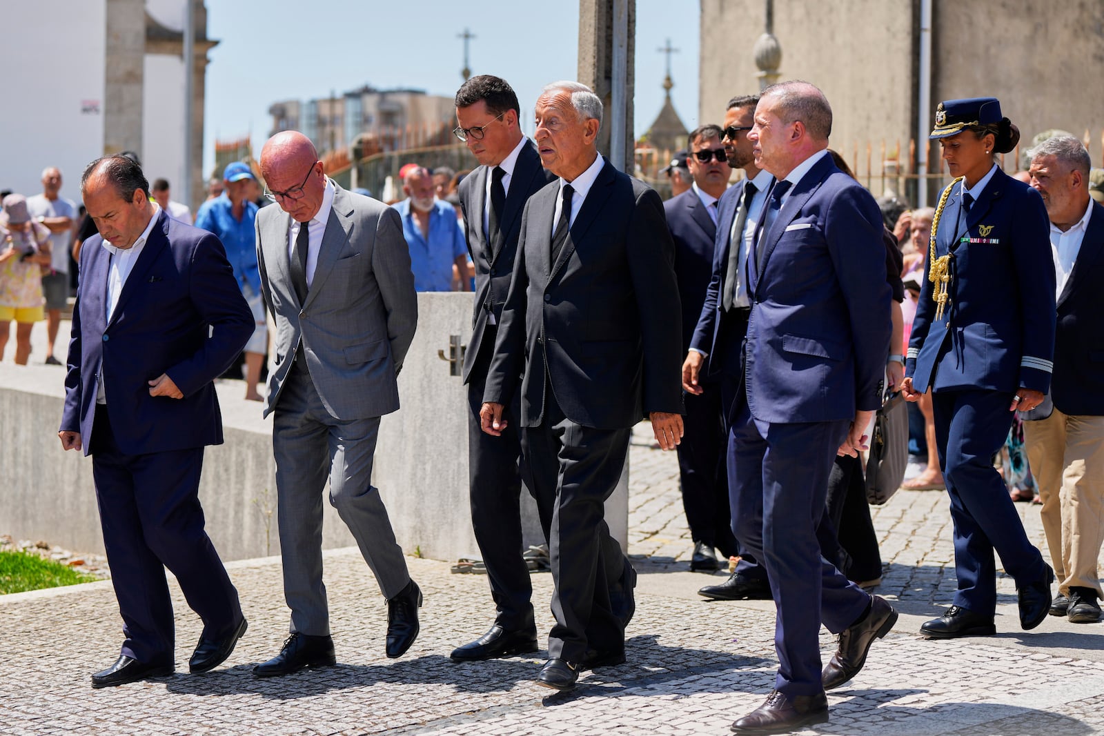 President of Portugal Marcelo Rebelo de Sousa, center, arrives at a church where the bodies of Liverpool forward Diogo Jota and André Silva have been brought for a wake and funeral, in Gondomar, near Porto, Portugal, on Friday, July 4, 2025. (AP Photo/Manu Fernandez)