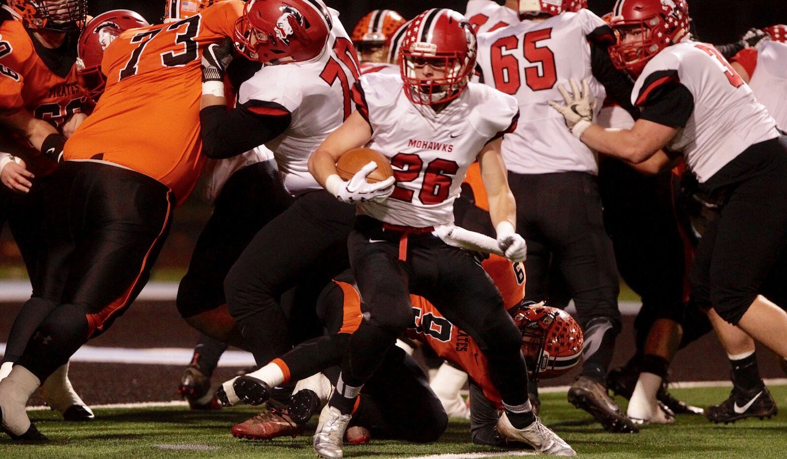 Madison’s Cameron Svarda (26) tries to figure out which way to go during Saturday night’s Division V, Region 20 championship game against Wheelersburg at Hilliard Darby Stadium. NICK GRAHAM/STAFF