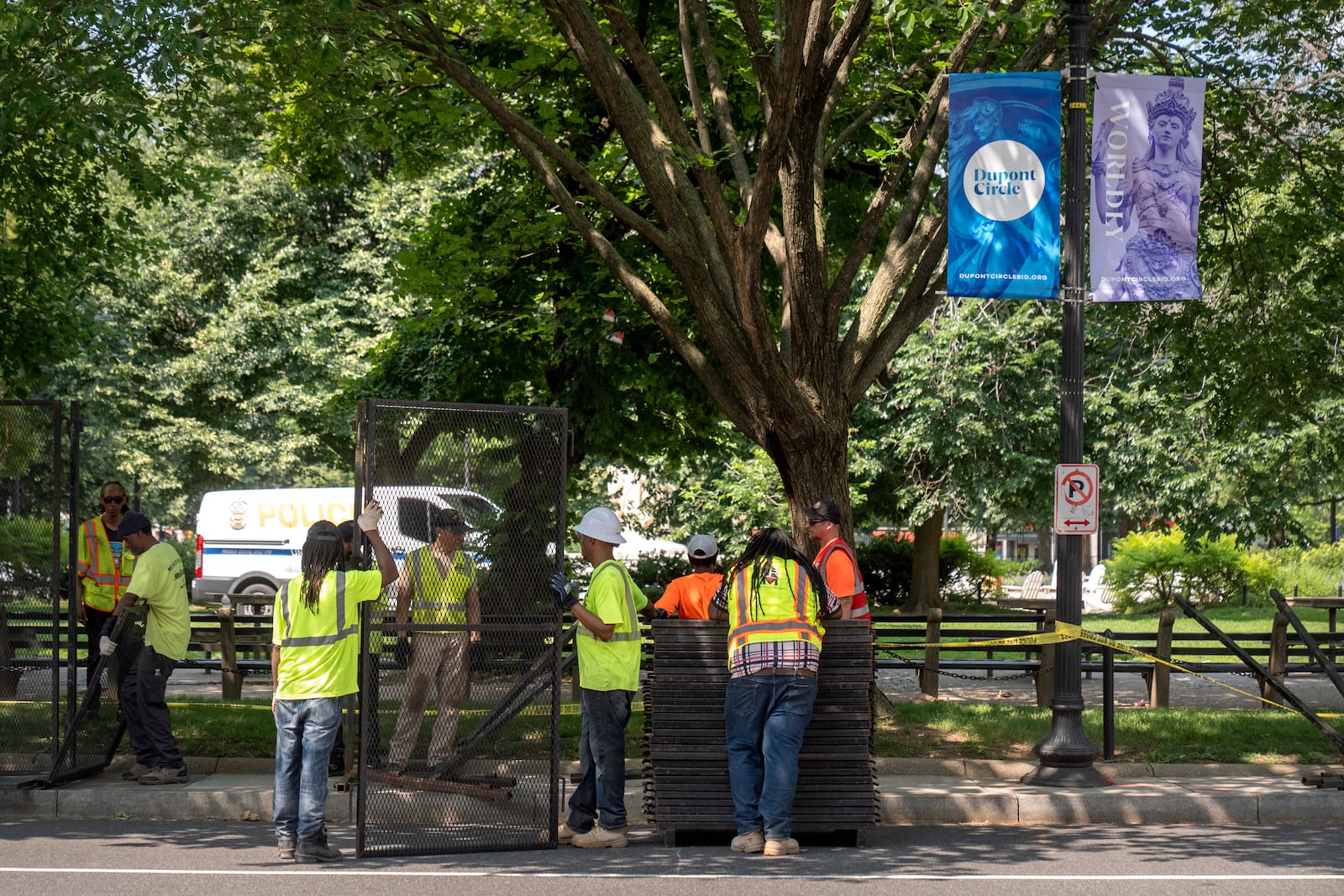 Workers put up fencing around Dupont Circle ahead of the World Pride Parade, Friday, June 6, 2025, in Washington. (AP Photo/Mark Schiefelbein)