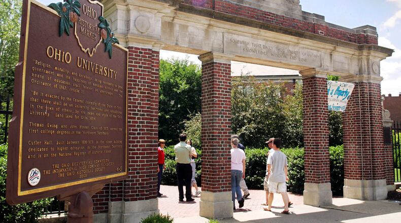 FILE - A historical marker stands near the gate at the Ohio University campus in Athens, Ohio on June 12, 2006.  Universities that adopted COVID-19 vaccine mandates this fall of 2021, have seen widespread compliance. That's true even though many schools made it easy to get out of the shots by granting exemptions to nearly any student who requested one. (AP Photo/Joe Maiorana, File)