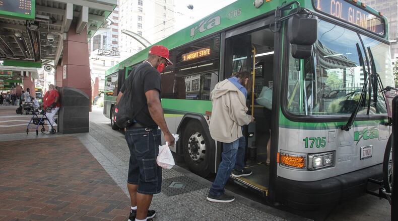 Ridership for RTA has fluctuated since the COVID-19 outbreak in March, and, right now, ridership is down 40% from 2019. Riders are shown on Thursday, Aug. 13, 2020. JIM NOEKLER/STAFF
