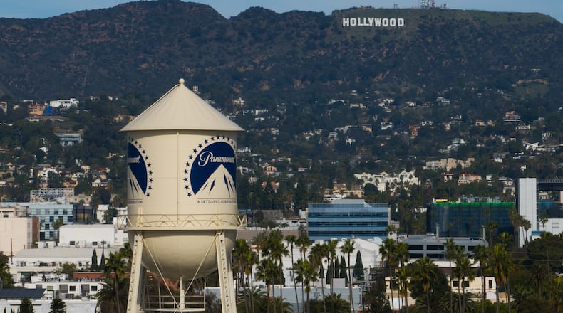 The Paramount Pictures water tower is seen in Los Angeles, Thursday, Dec. 18, 2025, with the Hollywood sign in the distance. (AP Photo/Jae C. Hong)