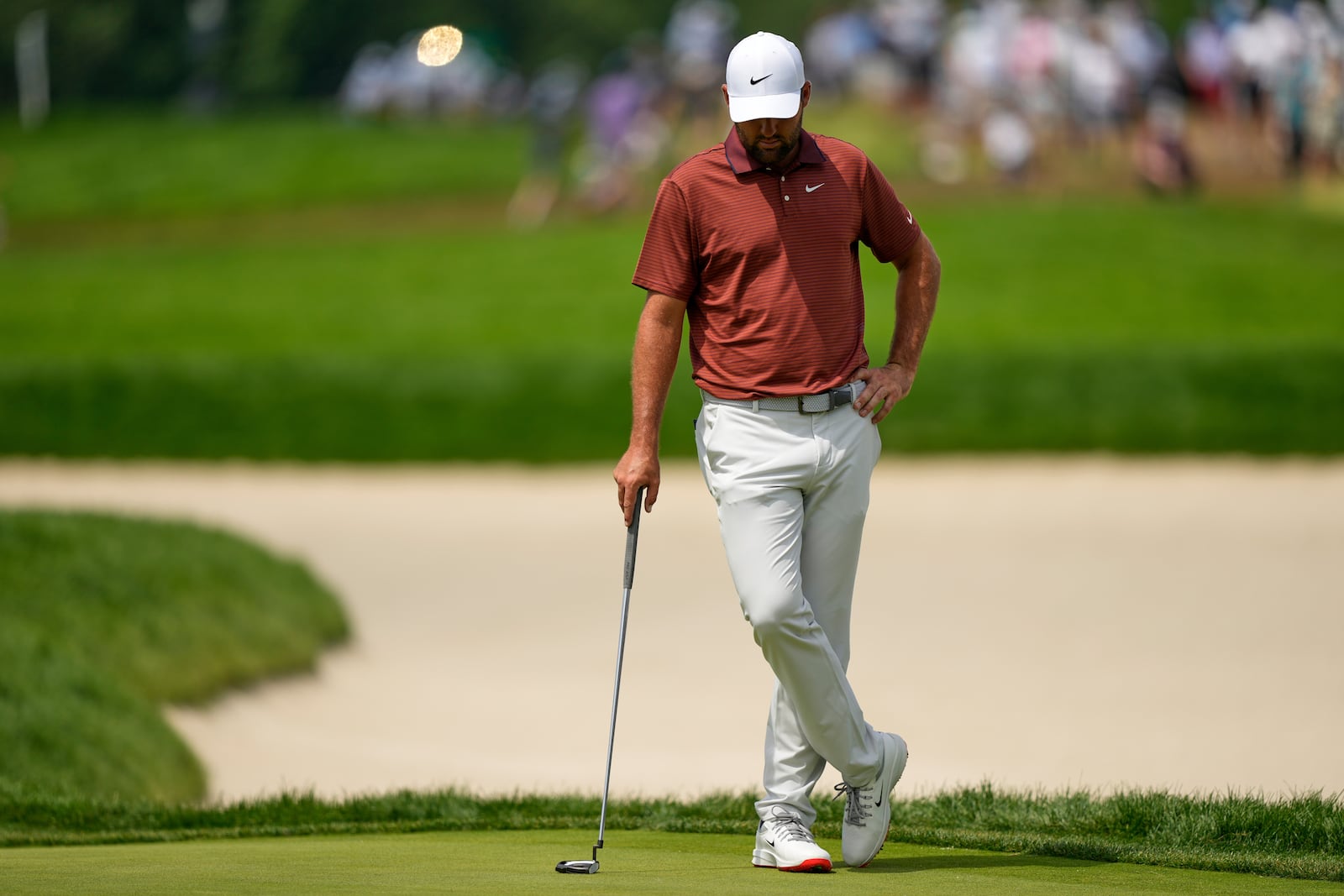 Scottie Scheffler waits to putt on the eighth hole during the third round of the U.S. Open golf tournament at Oakmont Country Club Saturday, June 14, 2025, in Oakmont, Pa. (AP Photo/Carolyn Kaster)