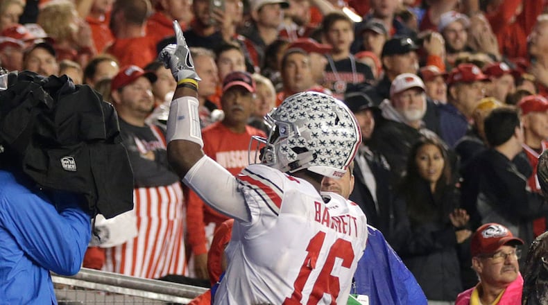 MADISON, WI - OCTOBER 15: J.T. Barrett #16 of the Ohio State Buckeyes celebrates after making a touchdown during the fourth quarter against the Wisconsin Badgers at Camp Randall Stadium on October 15, 2016 in Madison, Wisconsin. (Photo by Mike McGinnis/Getty Images)