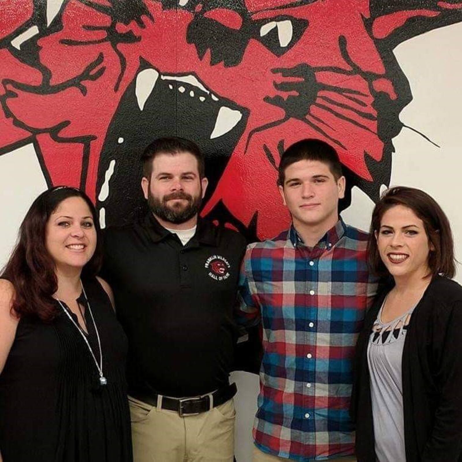 John Kremer (second from left) at his induction into the Franklin High Athletics Hall of Fame in 2017. With him are sisters Jemma and Jessica and brother Jared. (Contributed Photo)