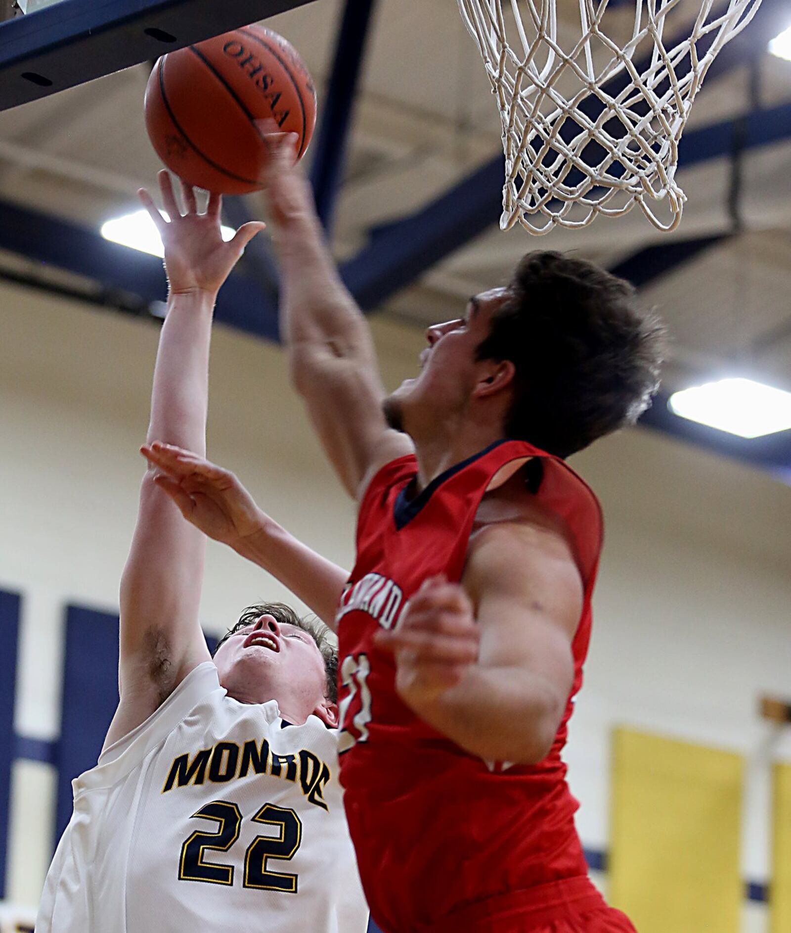 Monroe guard Tucker Triplett has his shot blocked by Talawanda’s Andrew O’Donnel during their game at Monroe on Tuesday night. CONTRIBUTED PHOTO BY E.L. HUBBARD