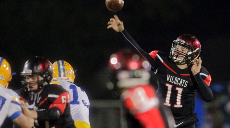 Franklin quarterback Braden White throws over teammate Nathaneel Rudd (64) during a Division III, Region 12 semifinal against St. Marys Memorial at Wayne’s Heidkamp Stadium on Nov. 12, 2016. St. Marys won 55-31. NICK GRAHAM/STAFF