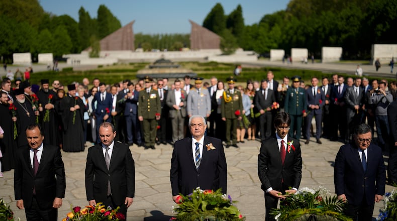 FILE — Russian ambassador in Germany Sergey Nechayev, center, attends a wreath laying ceremony to commemorate the end of World War II 77 years ago at the Soviet War Memorial at the district Treptow in Berlin, Germany, May 9, 2022. (AP Photo/Markus Schreiber, File)