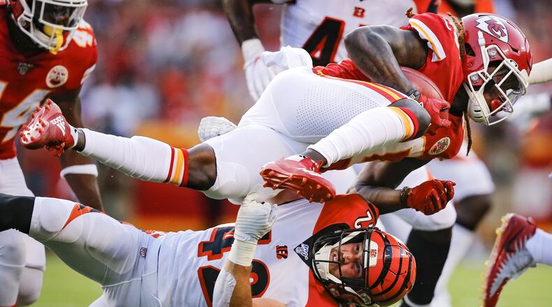 KANSAS CITY, MO - AUGUST 10: Tremon Smith #20 of the Kansas City Chiefs is tackled on a kick return by Clayton Fejedelem #42 of the Cincinnati Bengals in the first quarter during a preseason game at Arrowhead Stadium on August 10, 2019 in Kansas City, Missouri. (Photo by David Eulitt/Getty Images) ***BESTPIX***