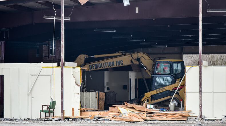 Demolition crews work to take down the Skating On Main roller skating rink Friday, Feb. 9, 2018 in Hamilton. NICK GRAHAM/STAFF