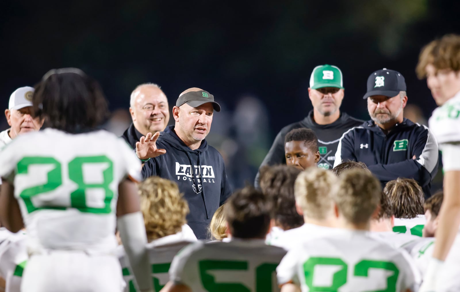 Badin head coach Nick Yordy talks to the team after their 10-6 win over Archbishop McNicholas in their football game Friday, Oct. 25, 2024 at McNicholas High School. NICK GRAHAM/STAFF