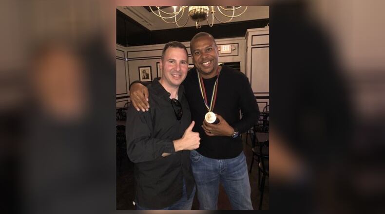 Dr. Martin Urban and Joe Greene, who’s wearing the bronze long jump medal he won at the 1992 Barcelona Olympics and Urban returned to him. CONTRIBUTED