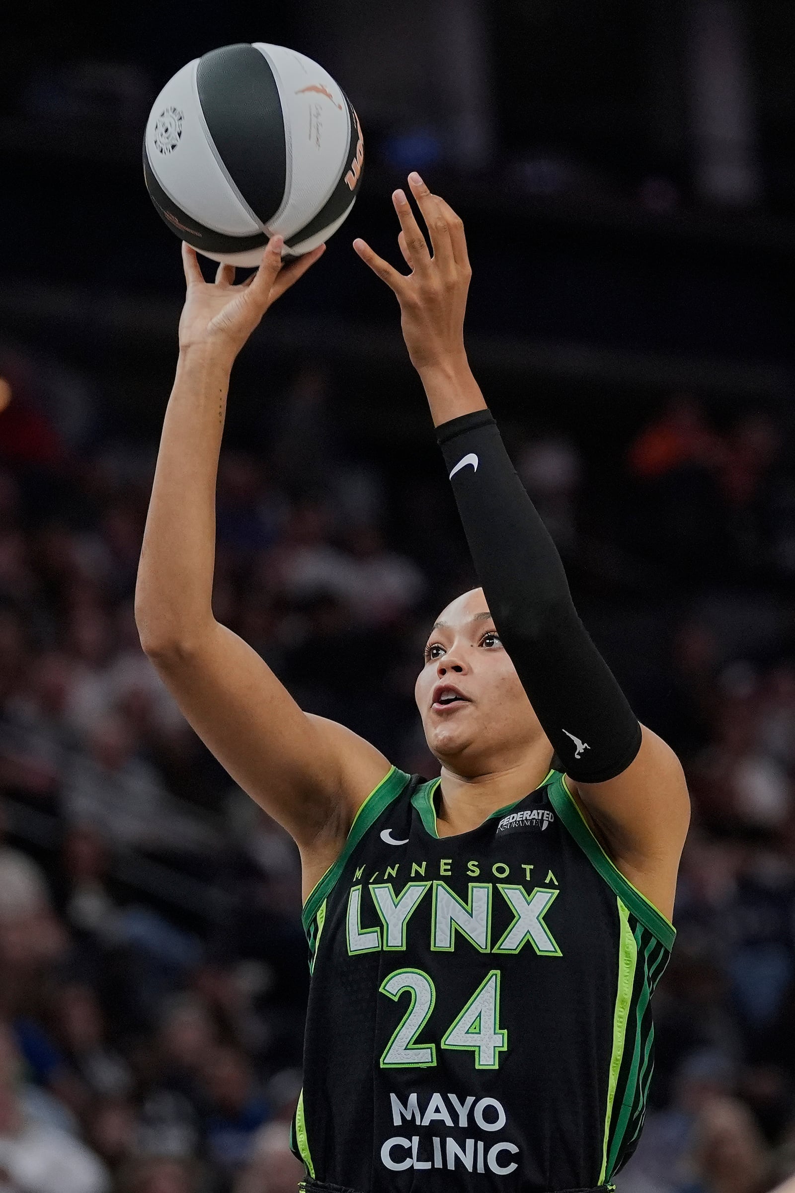 Minnesota Lynx forward Napheesa Collier (24) shoots during the second half of a WNBA basketball game against the Phoenix Mercury, Tuesday, June 3, 2025, in Minneapolis. (AP Photo/Abbie Parr)
