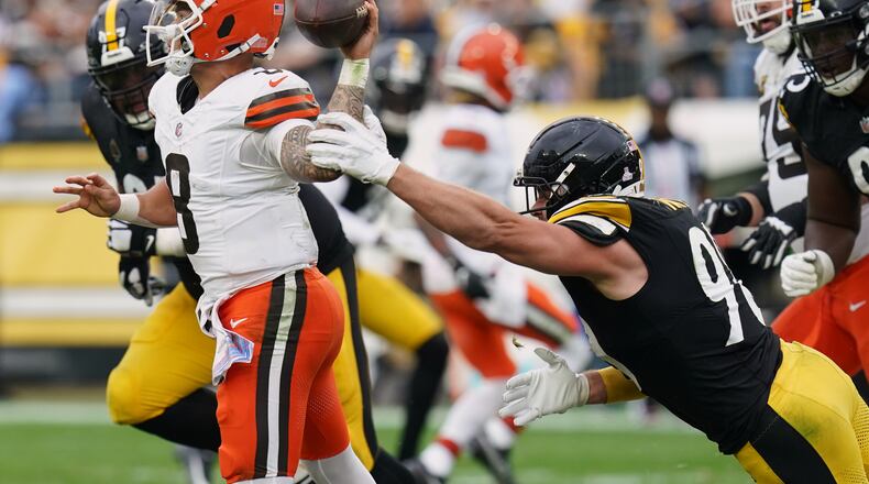 Pittsburgh Steelers outside linebacker T.J. Watt (90) pressures Cleveland Browns quarterback Dillon Gabriel (8) in the second half of an NFL football game in Pittsburgh, Sunday, Oct. 12, 2025. (AP Photo/Matt Freed)