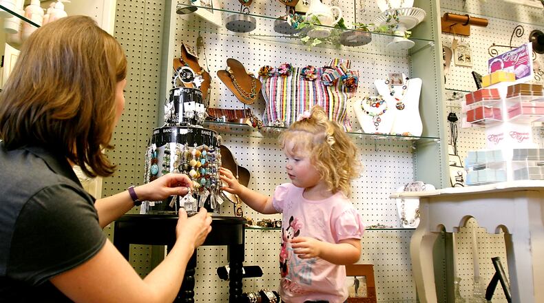 Becky Lawson and her daughter, Anna, shop at Pleasantree Gift Shoppe in this 2008 photo. Pleasantree’s owners said this week they will retire in February and close the store, which first opened 1988. STAFF FILE PHOTO
