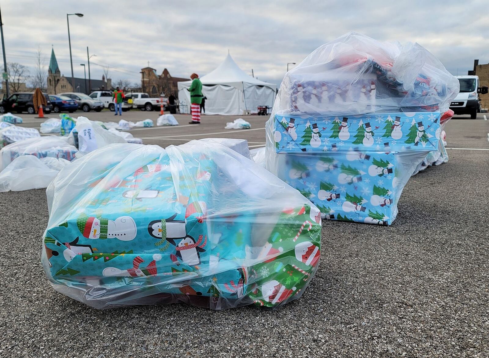 About 300 families received more than 1,000 presents Sunday during the 14th annual Louella Thompson's Feed the Hungry Project Toy Giveaway. NICK GRAHAM/STAFF