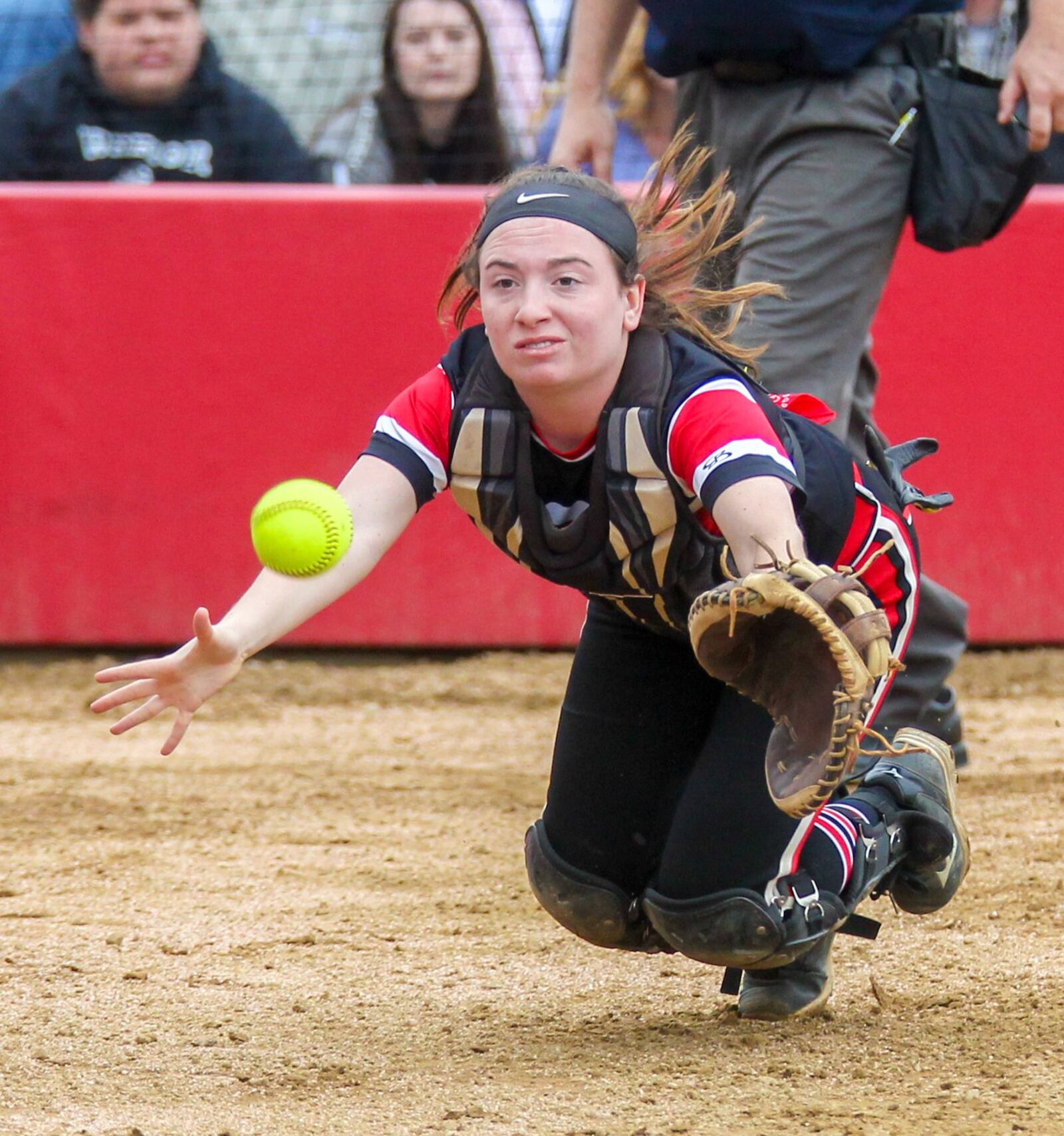 Lakota West catcher Kelsey Braswell (1) dives after a foul ball during Tuesday’s game against visiting Lakota East. GREG LYNCH/STAFF