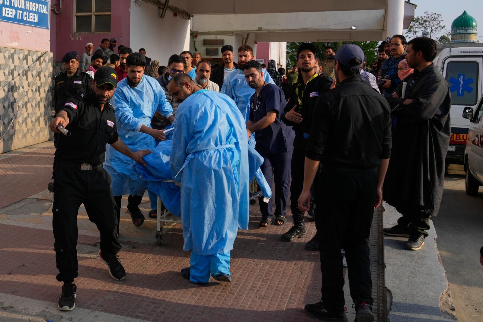 Paramedic carries a wounded tourist on a stretcher at a hospital in Anantnag after assailants indiscriminately fired at tourists visiting Pahalgam, Indian controlled Kashmir, Tuesday, April 22, 2025.(AP Photo/Dar Yasin)