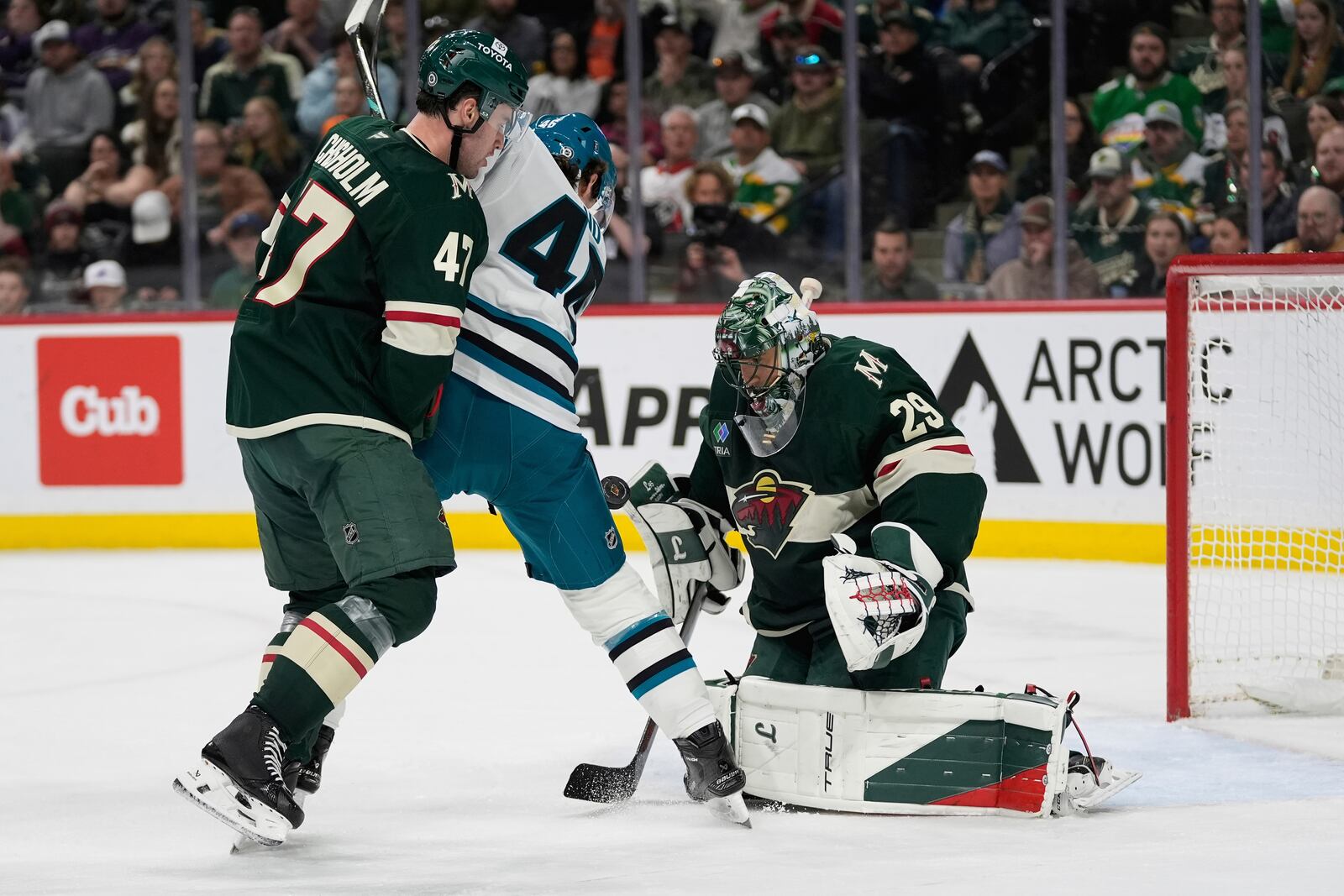 Minnesota Wild goaltender Marc-Andre Fleury (29) defends against a shot as San Jose Sharks center Cam Lund (46) pressures during the second period of an NHL hockey game, Wednesday, April 9, 2025, in St. Paul, Minn. (AP Photo/Abbie Parr)