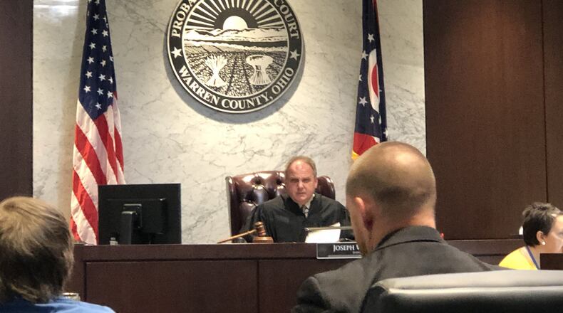 Judge Joe Kirby met Friday behind closed doors with the lawyers in the four juvenile cases stemming from a fatal shooting outside Lebanon in December. This picture was taken during the first hearing for Logan Dean, 16, of Washington Twp., Montgomery County, in Warren County Juvenile Court. Dean is sitting next to lawyer John Kaspar. STAFF/LAWRENCE BUDD