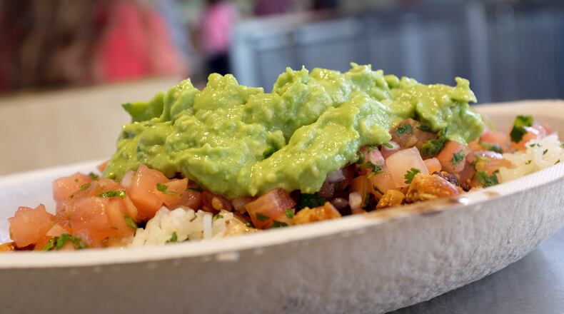 Chipotle announced Monday, Feb. 10, that to celebrate the upcoming one-year anniversary of Chipotle Rewards, it is launching "Guac Mode" and will give away free guacamole and extras to current and new loyalty program members throughout 2020. JOE RAEDLE/GETTY IMAGES