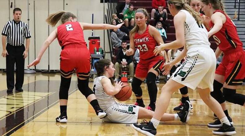 Badin’s Jaelynn Scowden (5) finds herself surrounded by Fenwick’s Hannah Tebbe (2), Brooke Brunner (23), Emily Adams and Rachel Tebbe (10) during Tuesday night’s Division II sectional game at Lebanon. Fenwick won 53-46. CONTRIBUTED PHOTO BY TERRI ADAMS