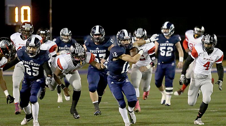Edgewood running back Julius Hayden breaks through the Mount Healthy defense Friday night at Kumler Field in Trenton. CONTRIBUTED PHOTO BY E.L. HUBBARD